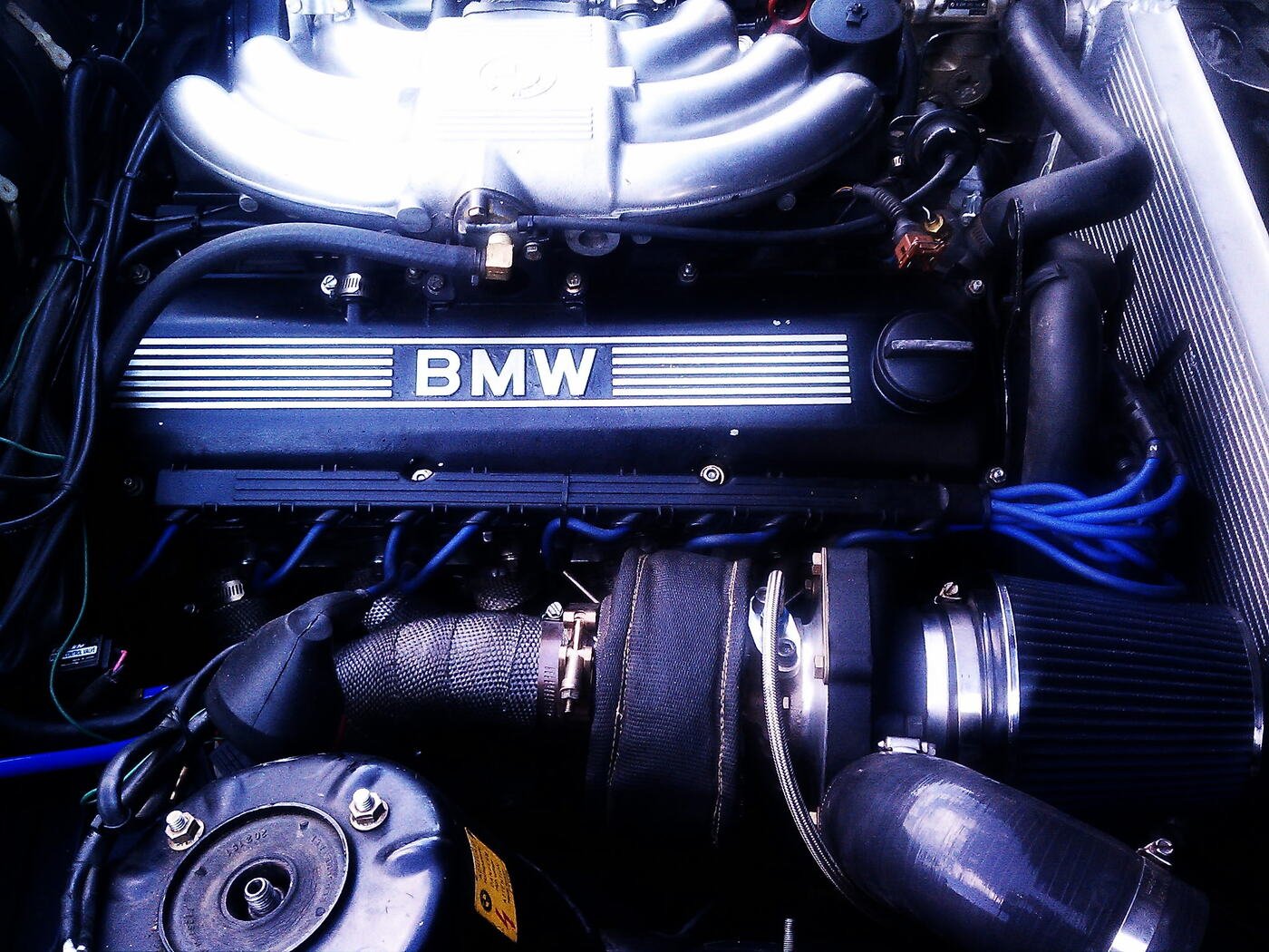 BMW engine bay with a custom turbo setup