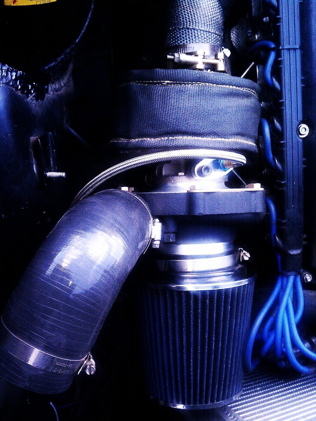 Close-up of a turbocharger and cold air intake