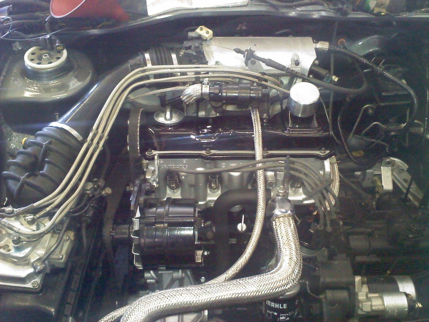 Engine bay fitted with braided steel lines