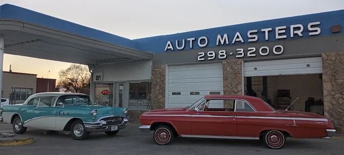 Front of the Auto Masters shop building with signage